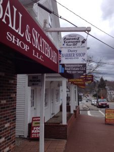custom awning and hanging storefront sign in Derry, NH